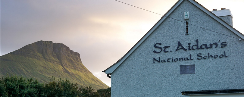 St Aidans NS Ballintrillick with Benwiskin mountain in sunlight