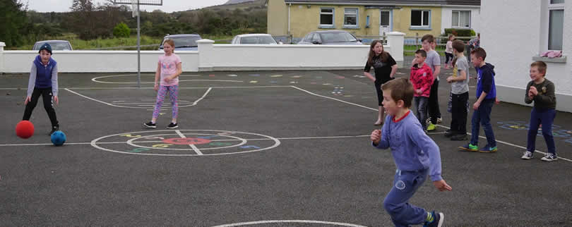 Children of St Aidan's NS playing dodgeball in the playground, Ballintrillick