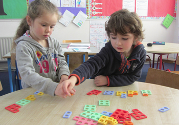 Boy & girl playing with bricks at St Aidans NS Ballintrillick