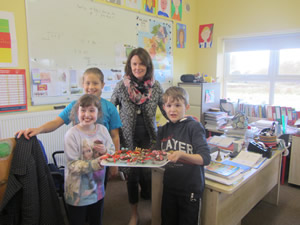 Mary Harrison, Principal St. Aidans NS, with pupils who have made cakes 