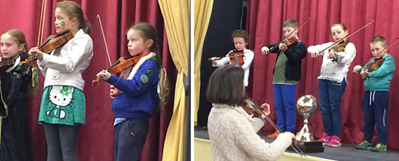Children at St Aidans playing fiddle in Cliffoney hall