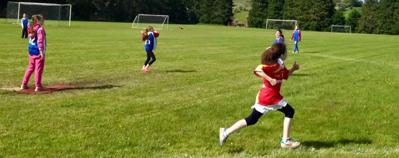 Girls from St Aidans National School playing rounders