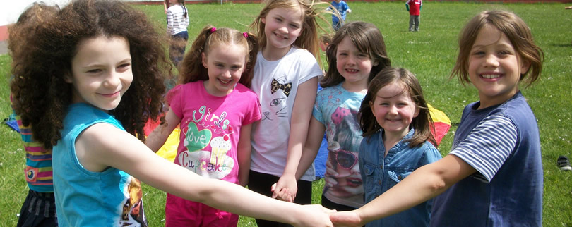 St Aidans Ballintrillick NS & some pupils enjoying themselves in garden