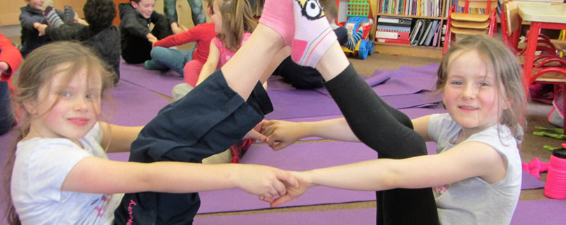 Children at St. Aidans practicing yoga